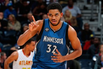 ATLANTA, GA - NOVEMBER 09:  Karl-Anthony Towns #32 of the Minnesota Timberwolves reacts after hitting a basket against the Atlanta Hawks at Philips Arena on November 9, 2015 in Atlanta, Georgia.  NOTE TO USER User expressly acknowledges and agrees that, by downloading and or using this photograph, user is consenting to the terms and conditions of the Getty Images License Agreement.  (Photo by Kevin C. Cox/Getty Images)