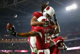 GLENDALE, AZ - DECEMBER 10: Wide receiver Michael Floyd #15 of the Arizona Cardinals celebrates with wide receiver Larry Fitzgerald #11 after scoring a 42 yard touchdown during the third quarter of the NFL game against the Minnesota Vikings at the University of Phoenix Stadium on December 10, 2015 in Glendale, Arizona.  (Photo by Christian Petersen/Getty Images)