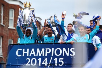 LONDON, ENGLAND - MAY 25: Didier Drogba and John Terry hold up the Premier League trophy and League Cup trophy as they exit the stadium during the Chelsea FC Premier League Victory Parade on May 25, 2015 in London, England, (Photo by Charlie Crowhurst/Getty Images)